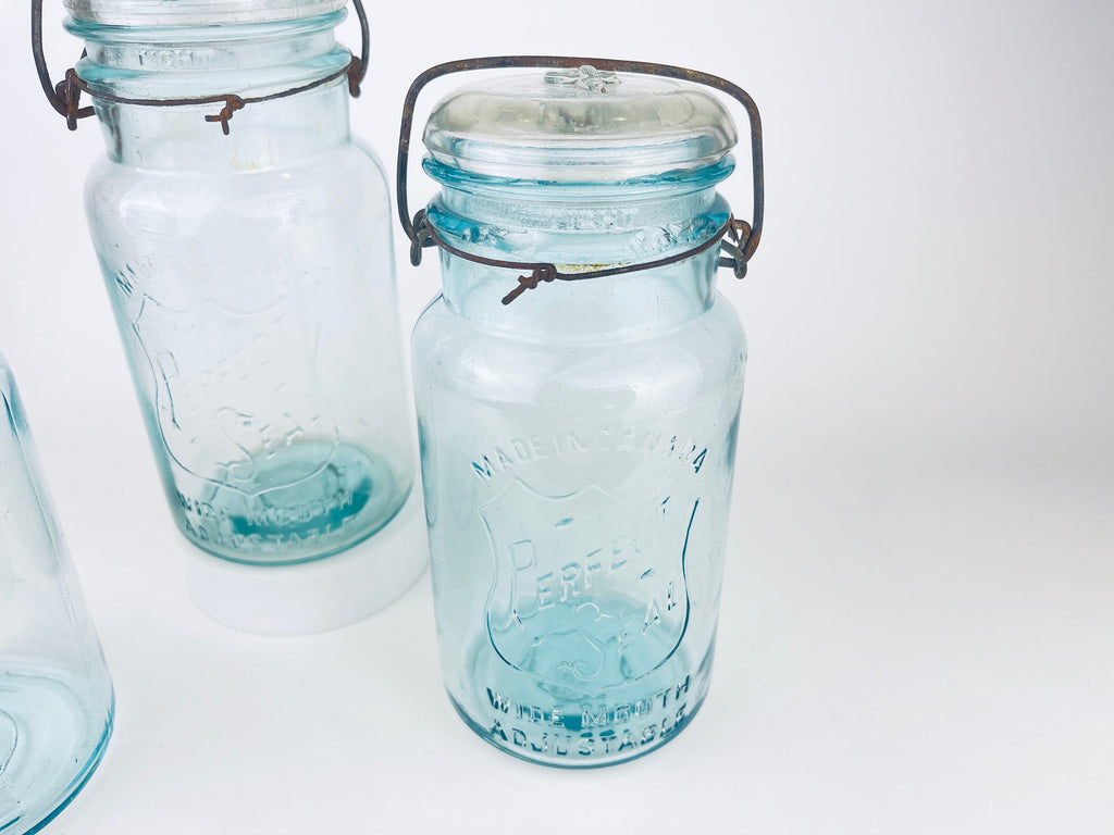 Product image for 'antique safety seal wide mouth aqua blue glass jar 2 pint capacity lightning metal hinge clasp made in canada sold separately 1' (view 82d6d9)