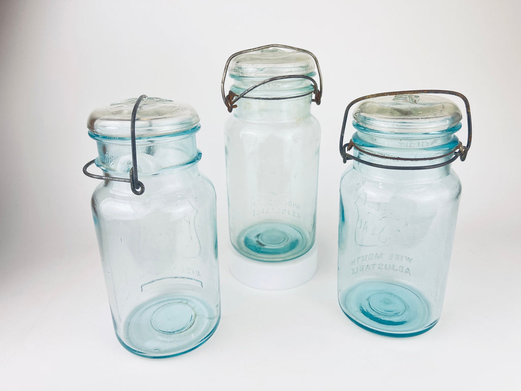 Product image for 'antique safety seal wide mouth aqua blue glass jar 2 pint capacity lightning metal hinge clasp made in canada sold separately 1' (view 4c6dc4)
