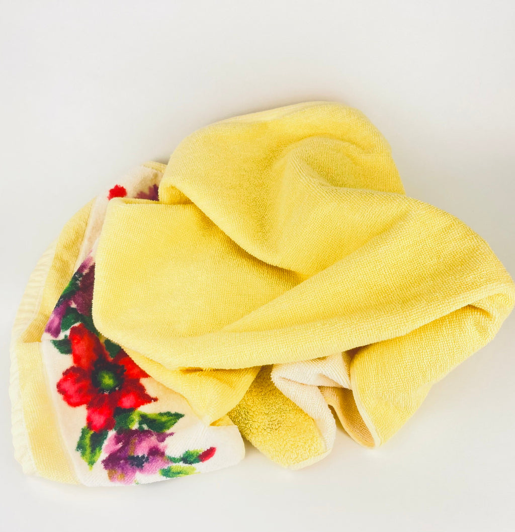 Yellow towel with floral pattern on a white background