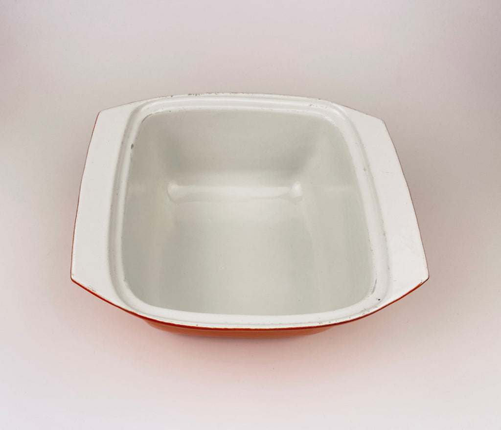 White ceramic coated cast iron square bowl on a light gray background