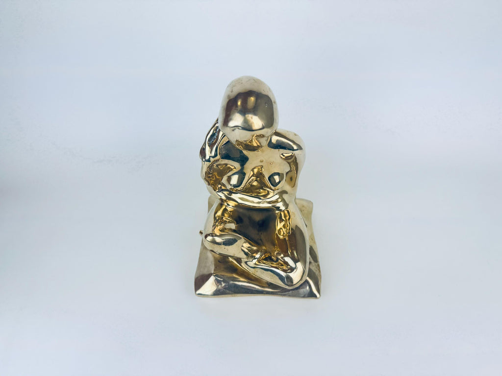 Gold woman statue on a white background