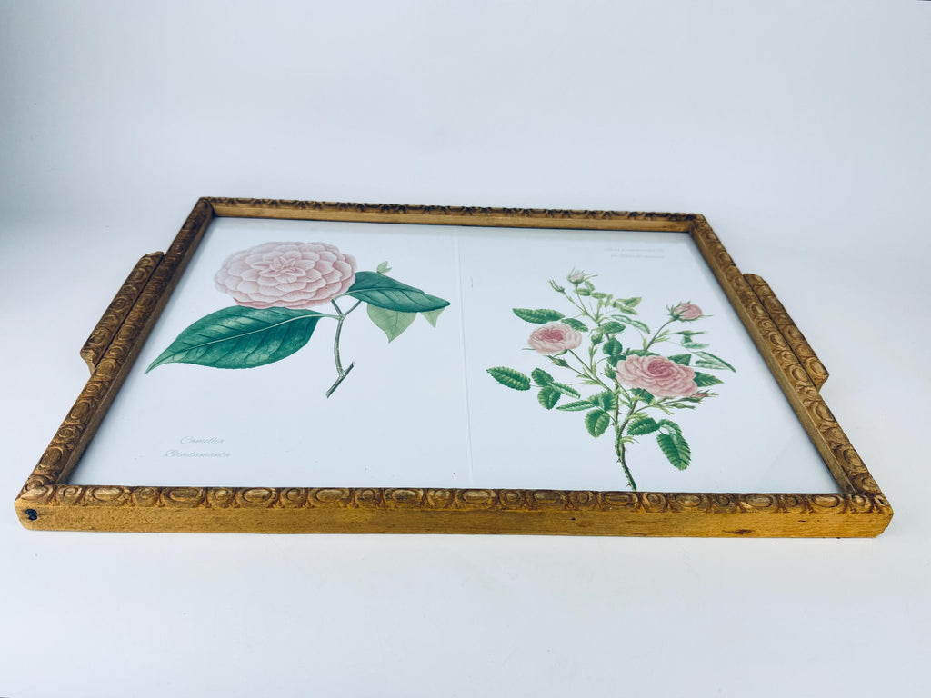 Framed botanical illustration of flowers in carved wooden handled tray.