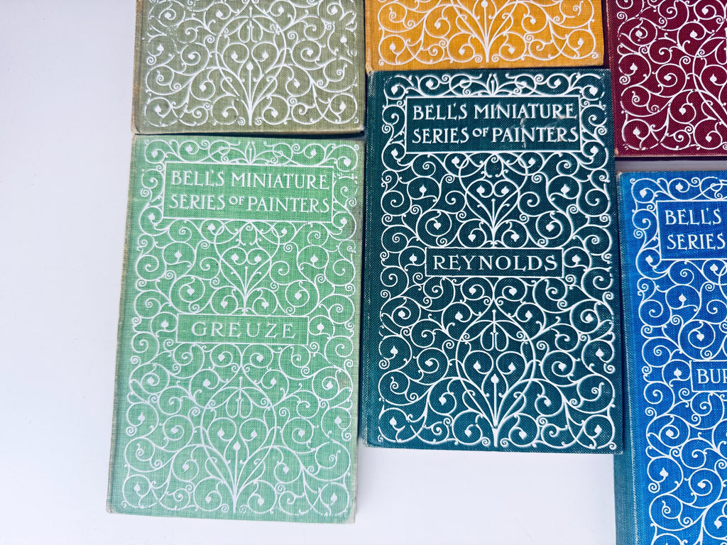 Collection of books with decorative covers on a white background