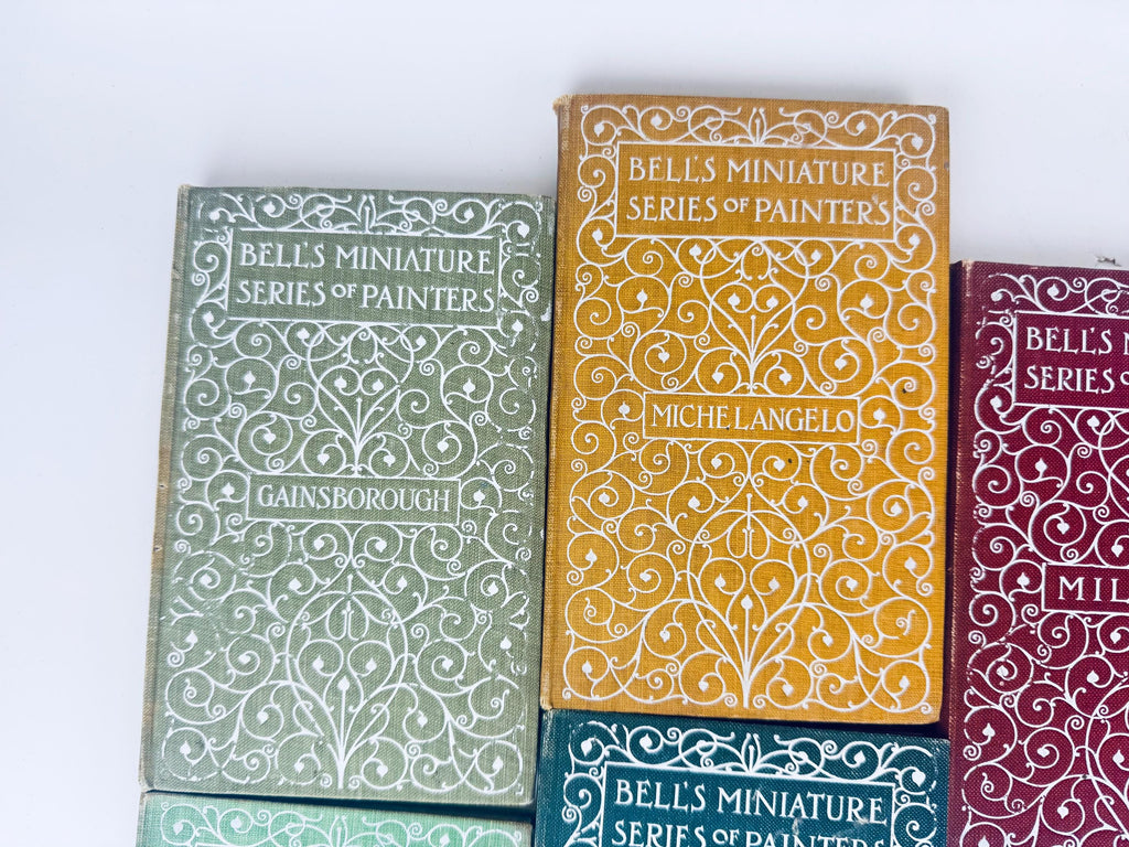 Collection of books with decorative covers on a white background