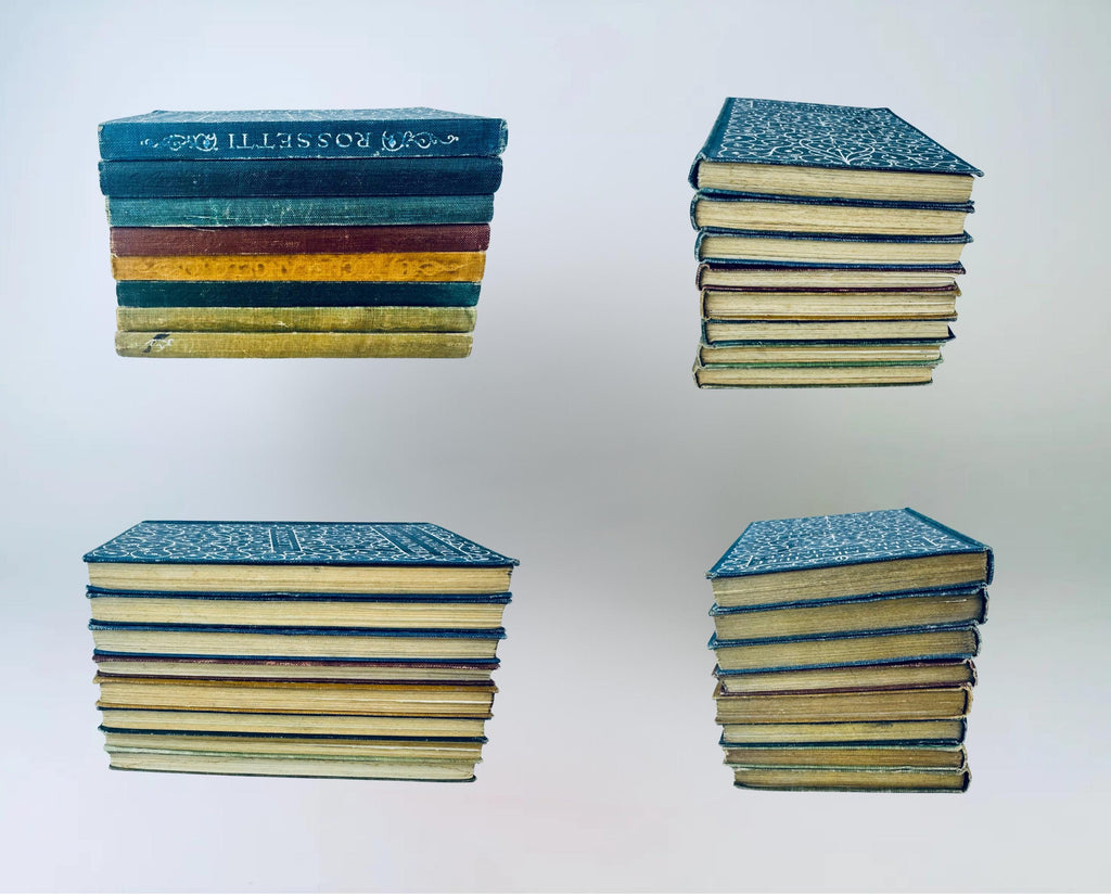 Stacks of vintage books with colorful spines on a white background