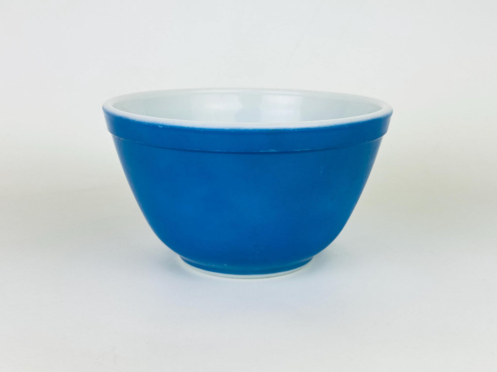Blue glass bowl on a white background
