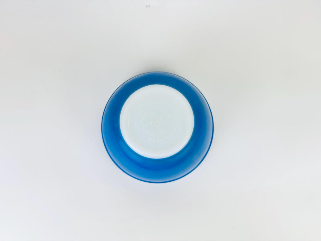 Blue circular object on a white background