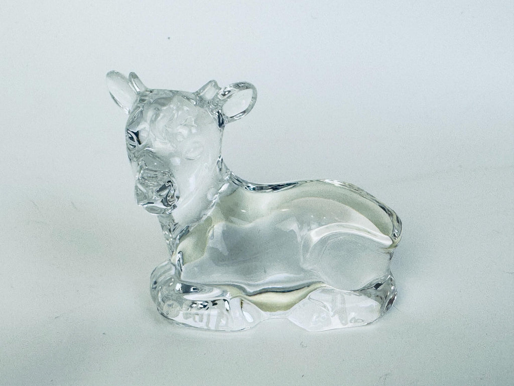 âCrystal cow figurine from Marquis by Waterford nativity animals, lying down with smooth and faceted surfaces.