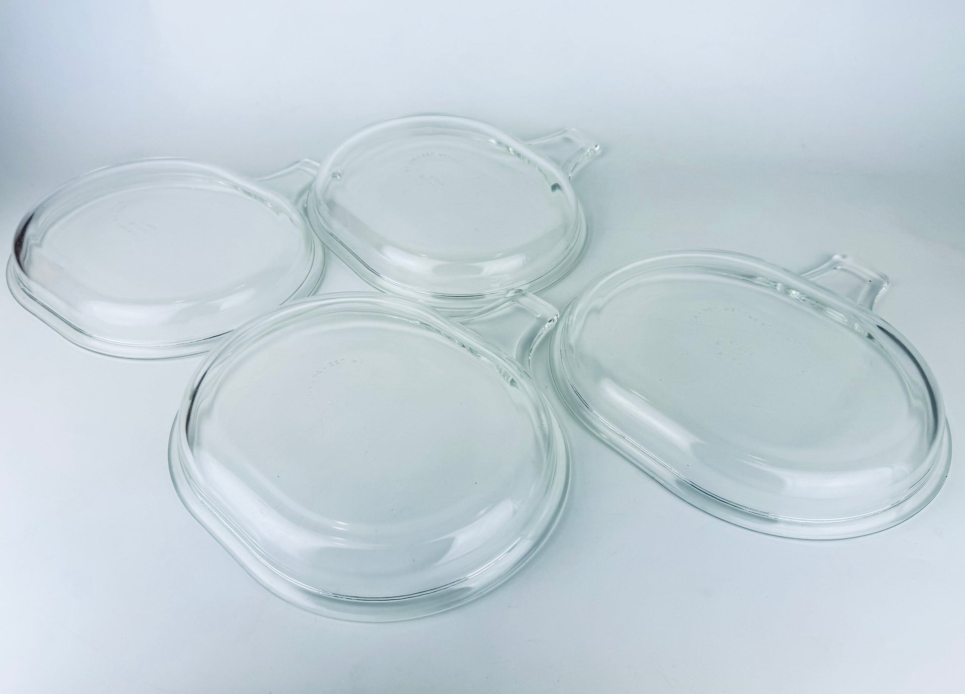Product image for 'vintage pyrex clear glass grab it microwave oven plates set of two 2 600 b 15 cm x 20 cm made in usa sets sold separately' (view 3c95e2)