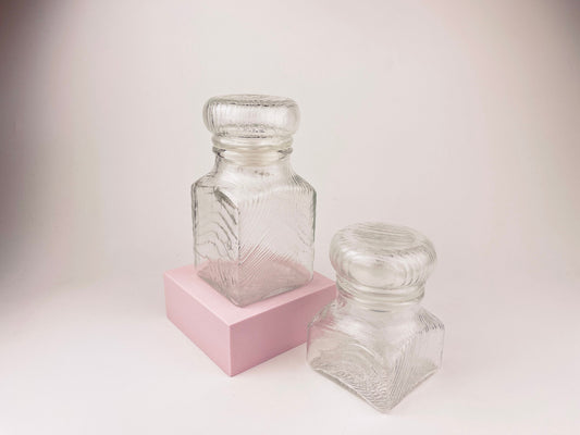 Product image for 'vintage 1970s airtight glass jars with faux wood grain lids set of 2' (view 13f5ea)