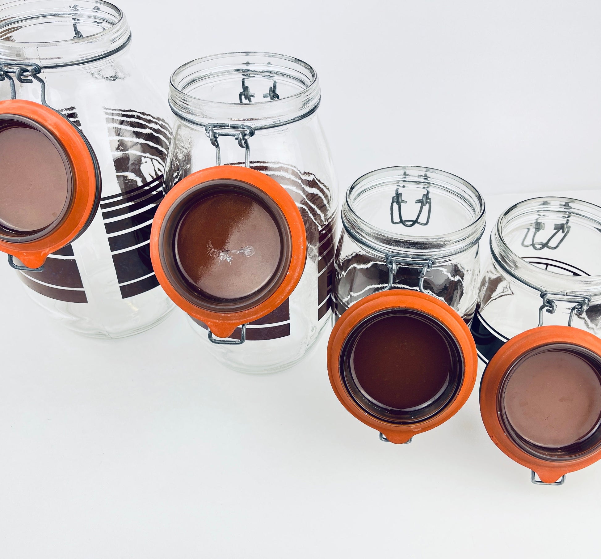Product image for 'vintage brown striped glass canister set 1980s kitchen storage with orange seals' (view eea393)