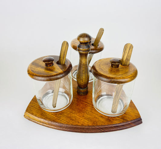 Product image for 'vintage mid century glass condiment caddy set trio of jars with wooden lids spoons' (view 603613)