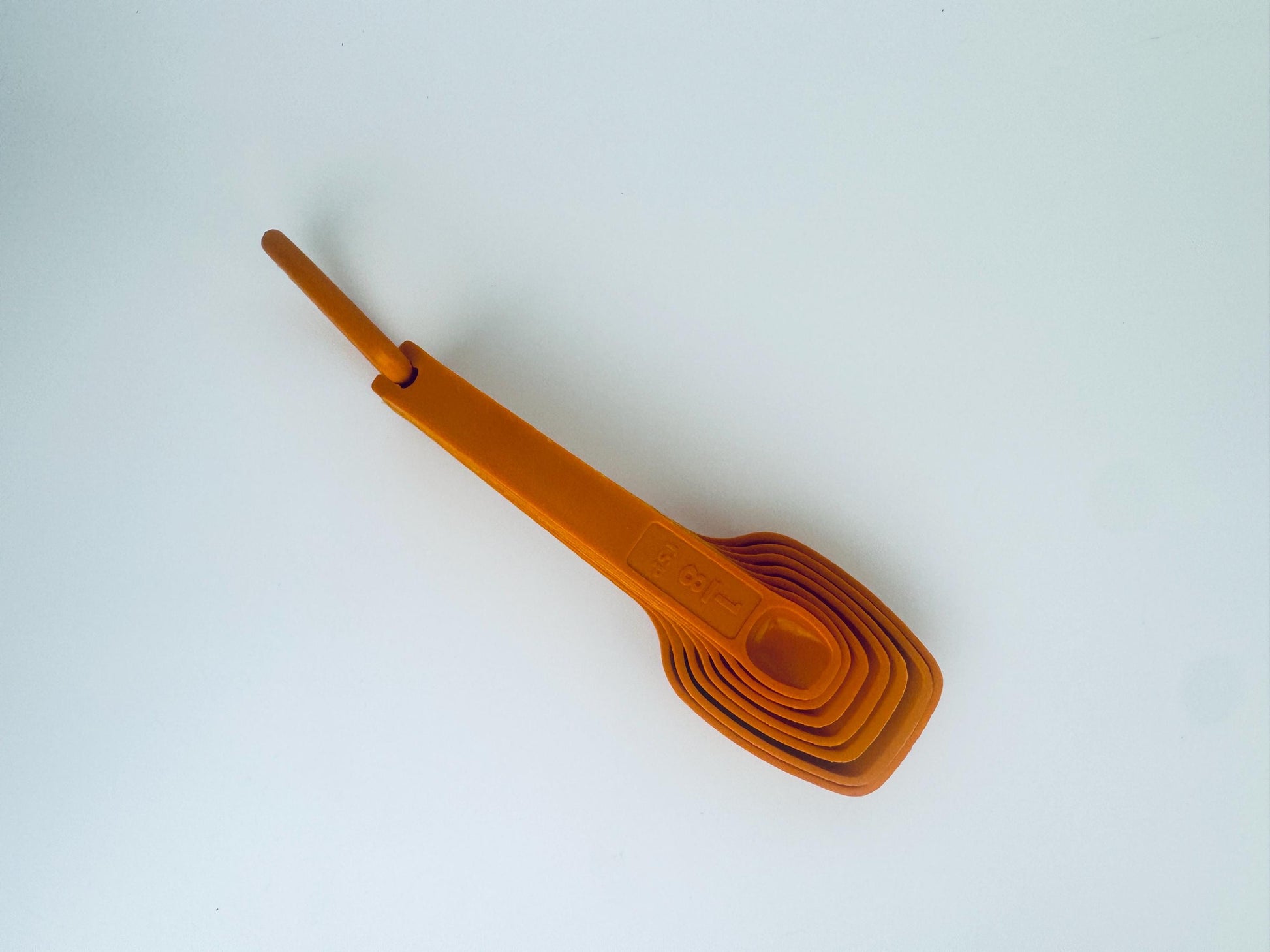 Product image for 'vintage 1980s tupperware orange plastic stacking measuring spoons classic retro kitchenware' (view c03899)