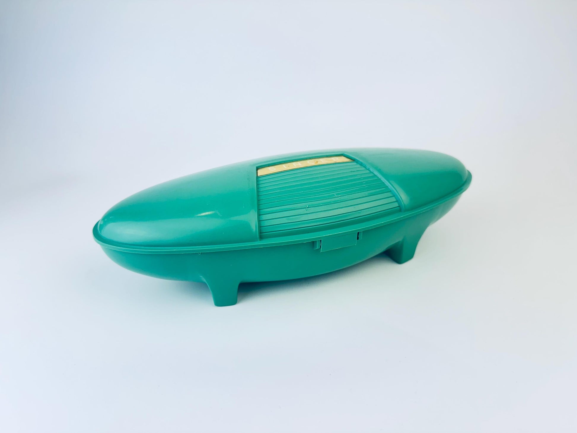 Product image for 'vintage singer slant shank buttonhole attachment 489510 patent 2482607 made in usa atomic jetsons aqua green case' (view cb1e40)