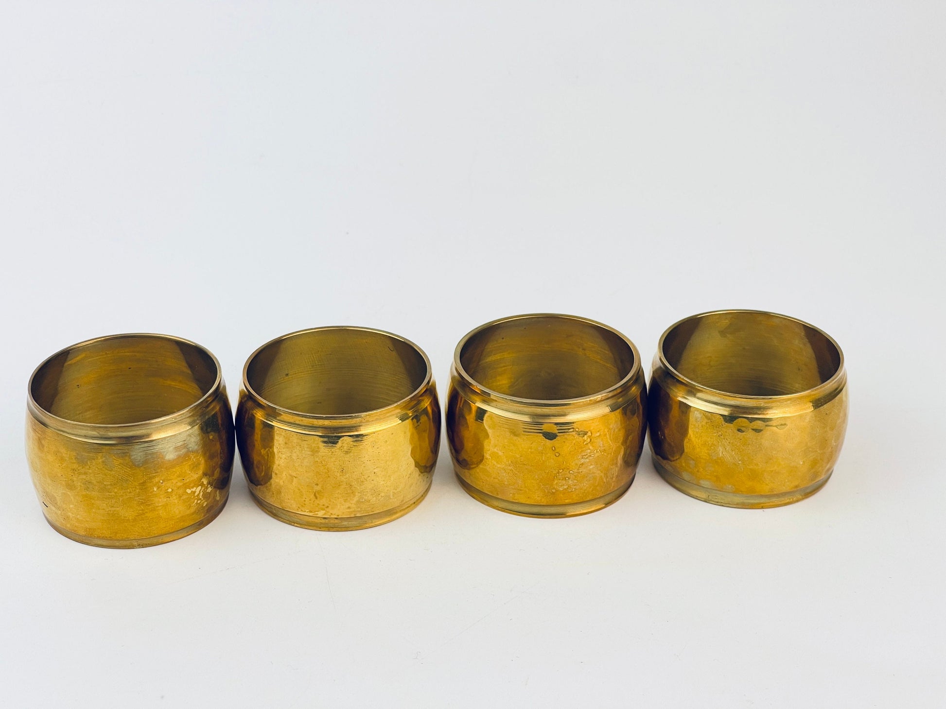 Product image for 'vintage hammered brass barrel shaped napkin ring holders set of four 4 attractive aged metal patina' (view e478d1)