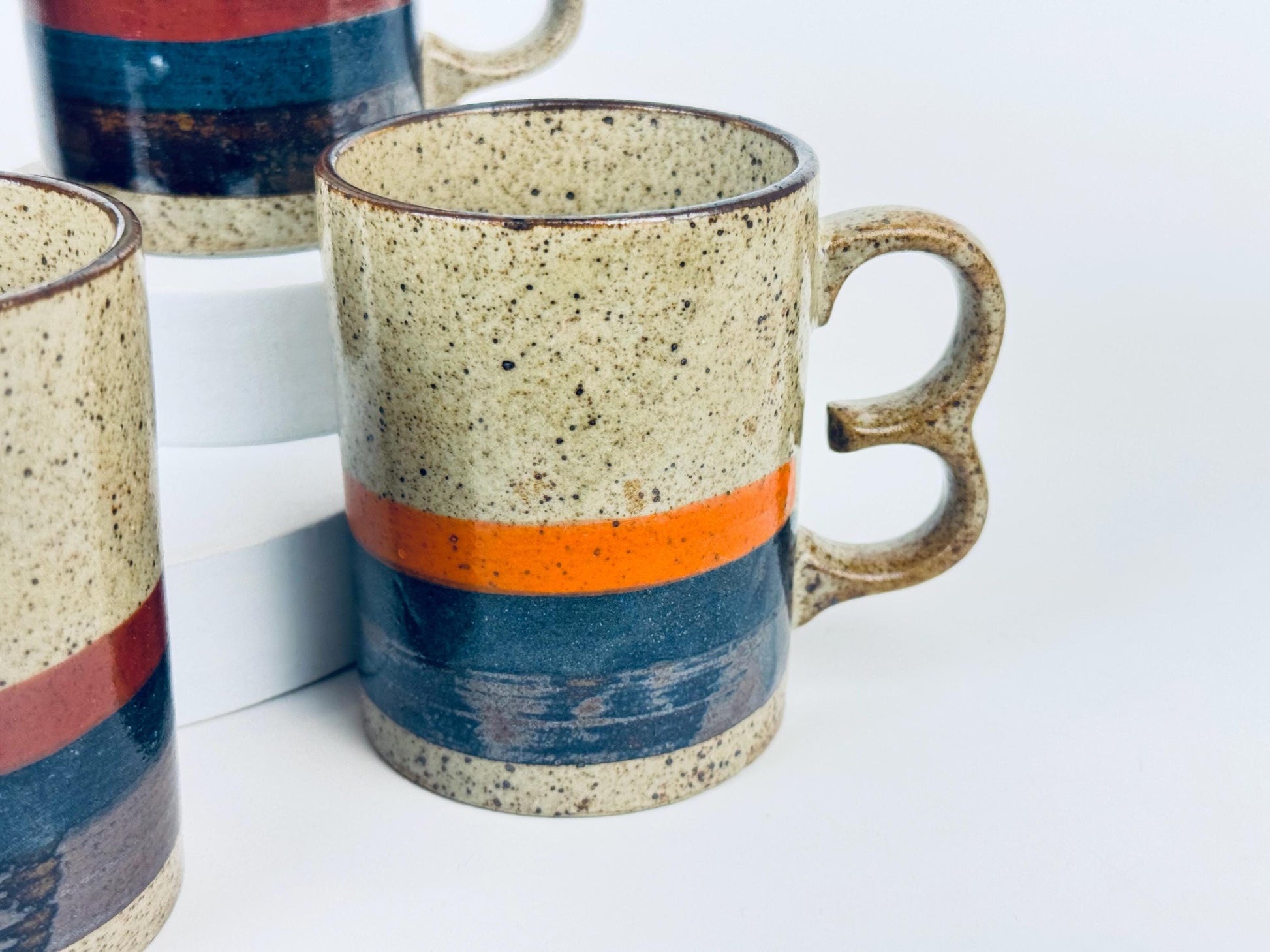 Product image for 'vintage 1970s stoneware mugs speckled glaze with bold stripes double loop handles set of 4 retro coffee cups' (view 0ff142)