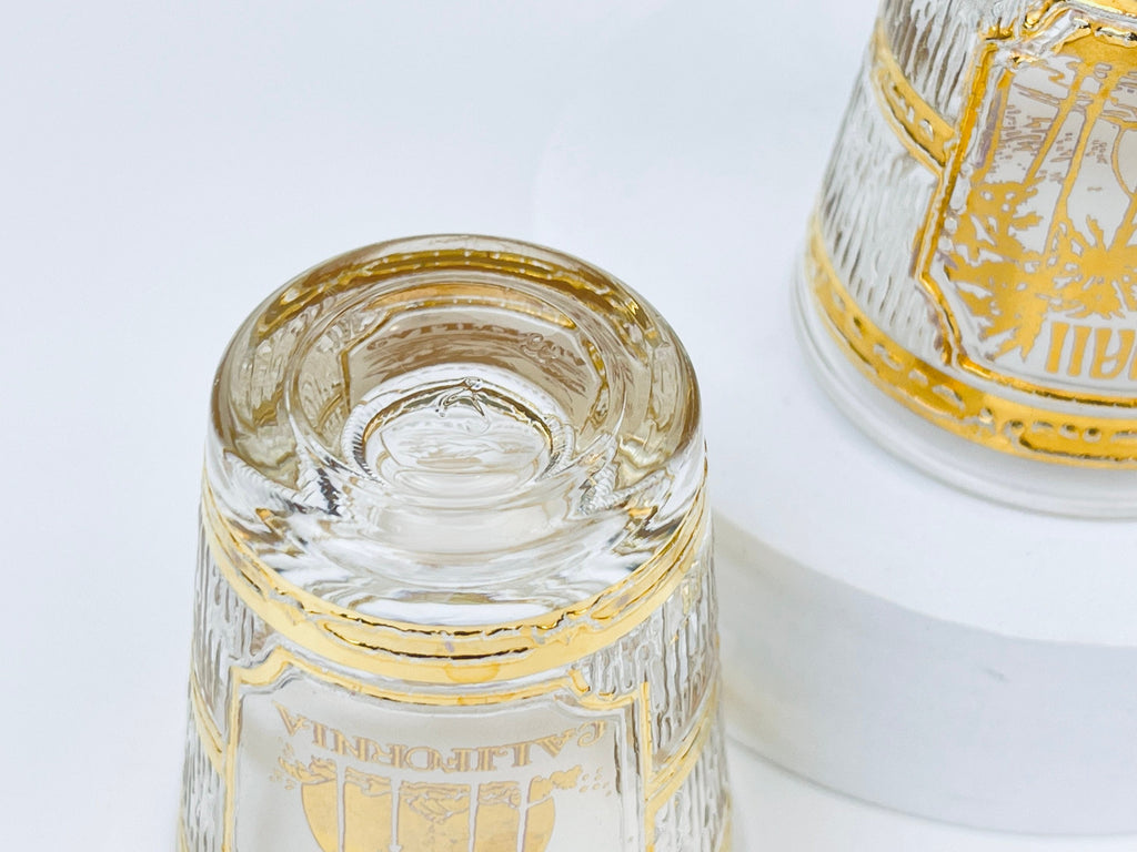 Product image for 'vintage culver tyrol heavy glass 22 kt gold souvenir shot glasses hawaii universal studios california sold individually' (view f09694)