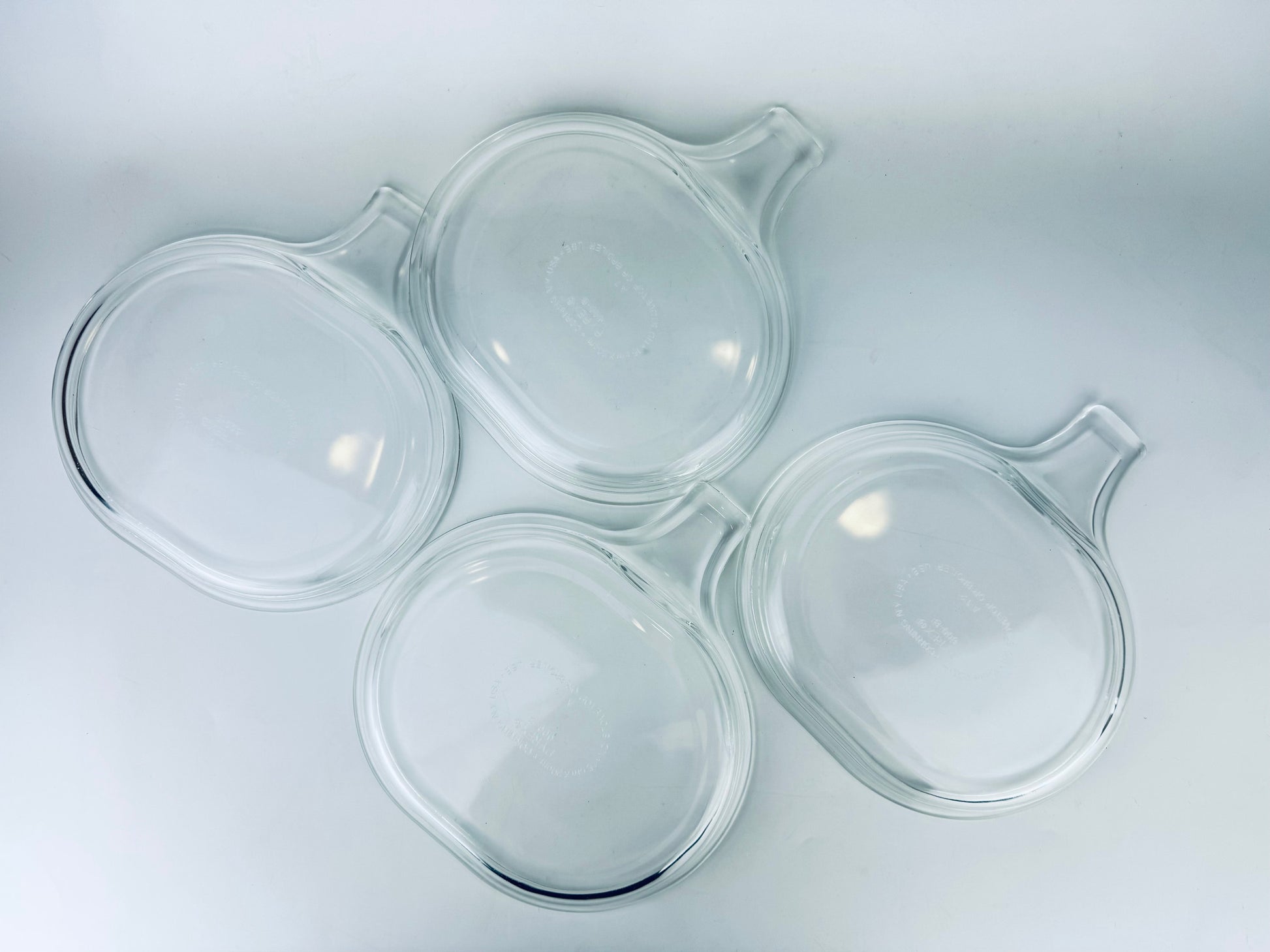 Product image for 'vintage pyrex clear glass grab it microwave oven plates set of two 2 600 b 15 cm x 20 cm made in usa sets sold separately' (view 3f7551)