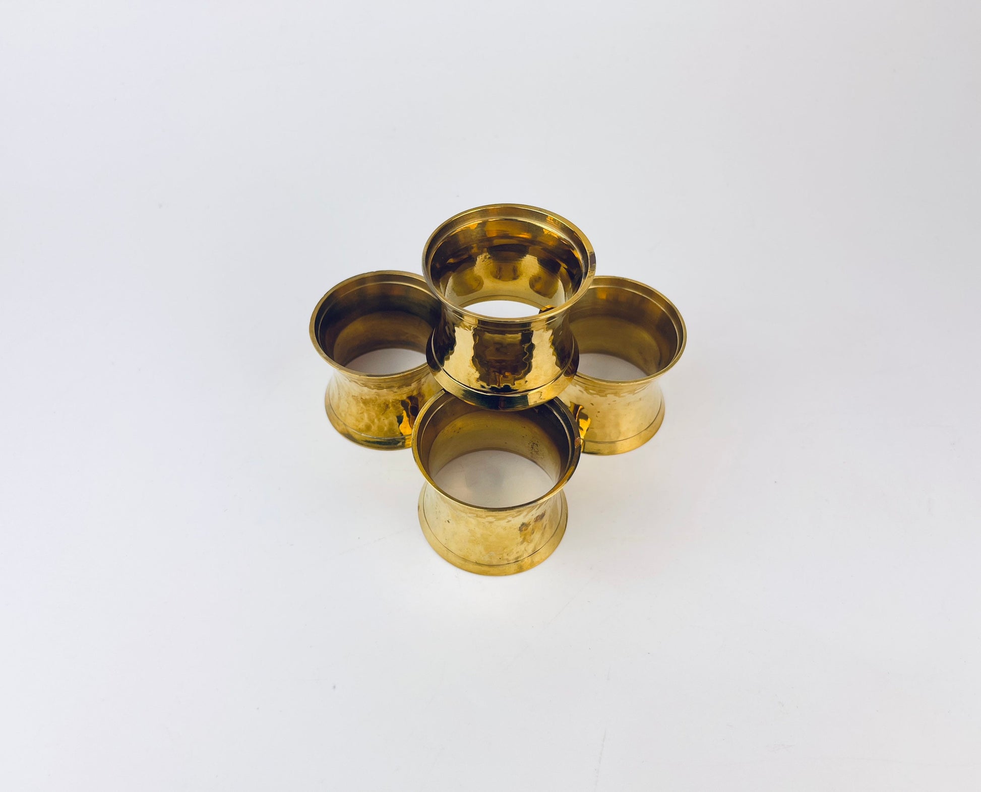 Product image for 'vintage hammered brass hourglass shaped napkin ring holders set of four 4 attractive aged metal patina' (view a34a21)