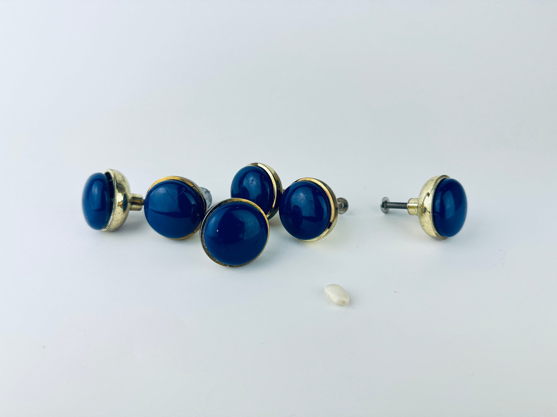 Product image for 'vintage 1980s blue plastic brass circular knob drawer pull hardware attractive aged brass patina' (view 33761c)