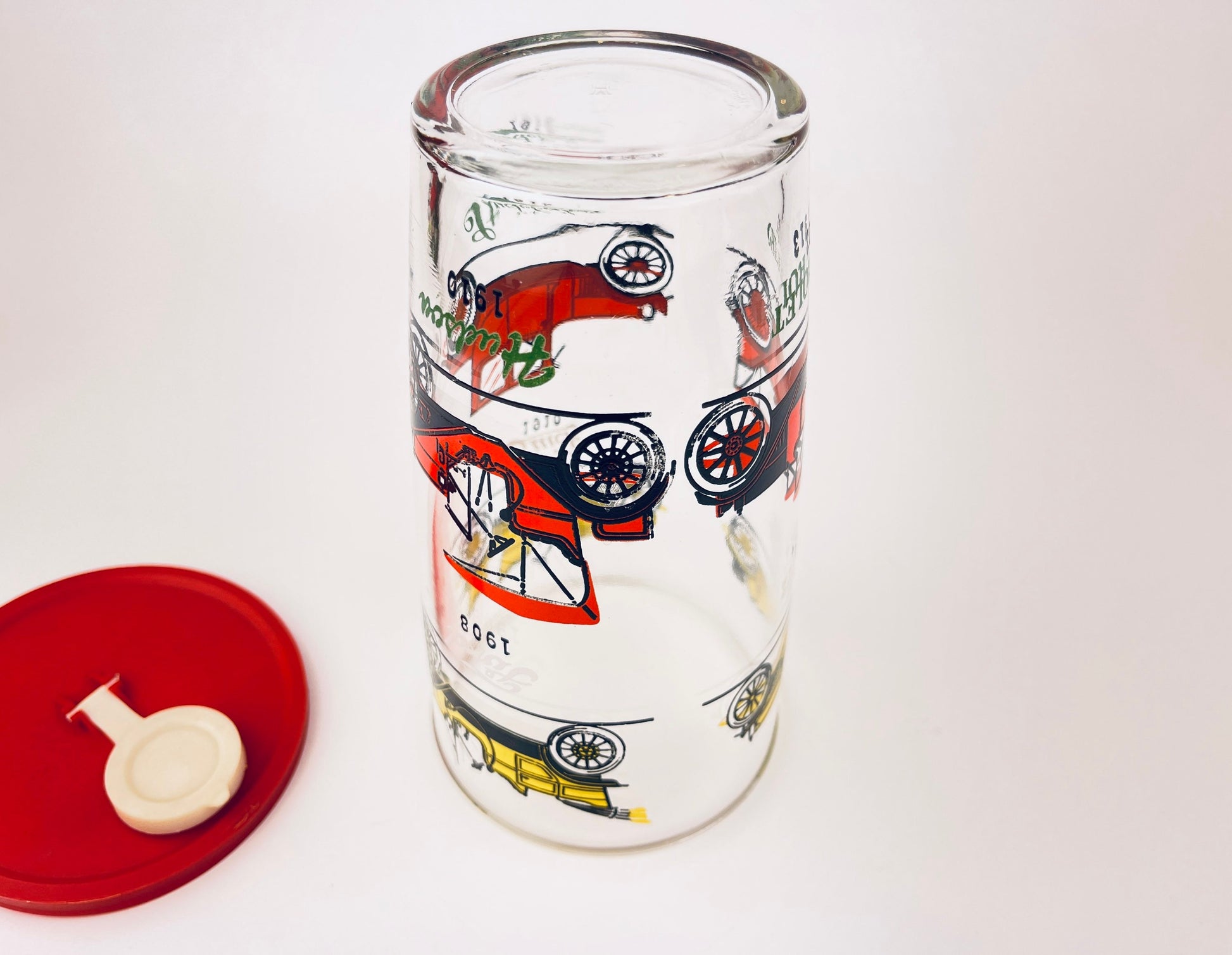 Product image for 'vintage 1970s hazel atlas cocktail shaker with antique car design red plastic lid' (view 24d9fe)
