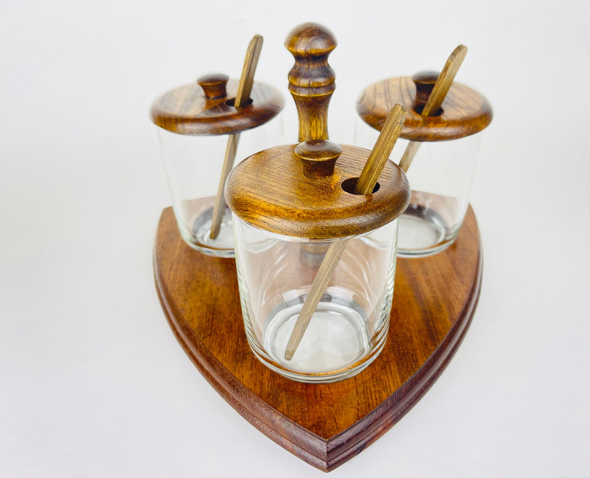 Product image for 'vintage mid century glass condiment caddy set trio of jars with wooden lids spoons' (view b44cc6)