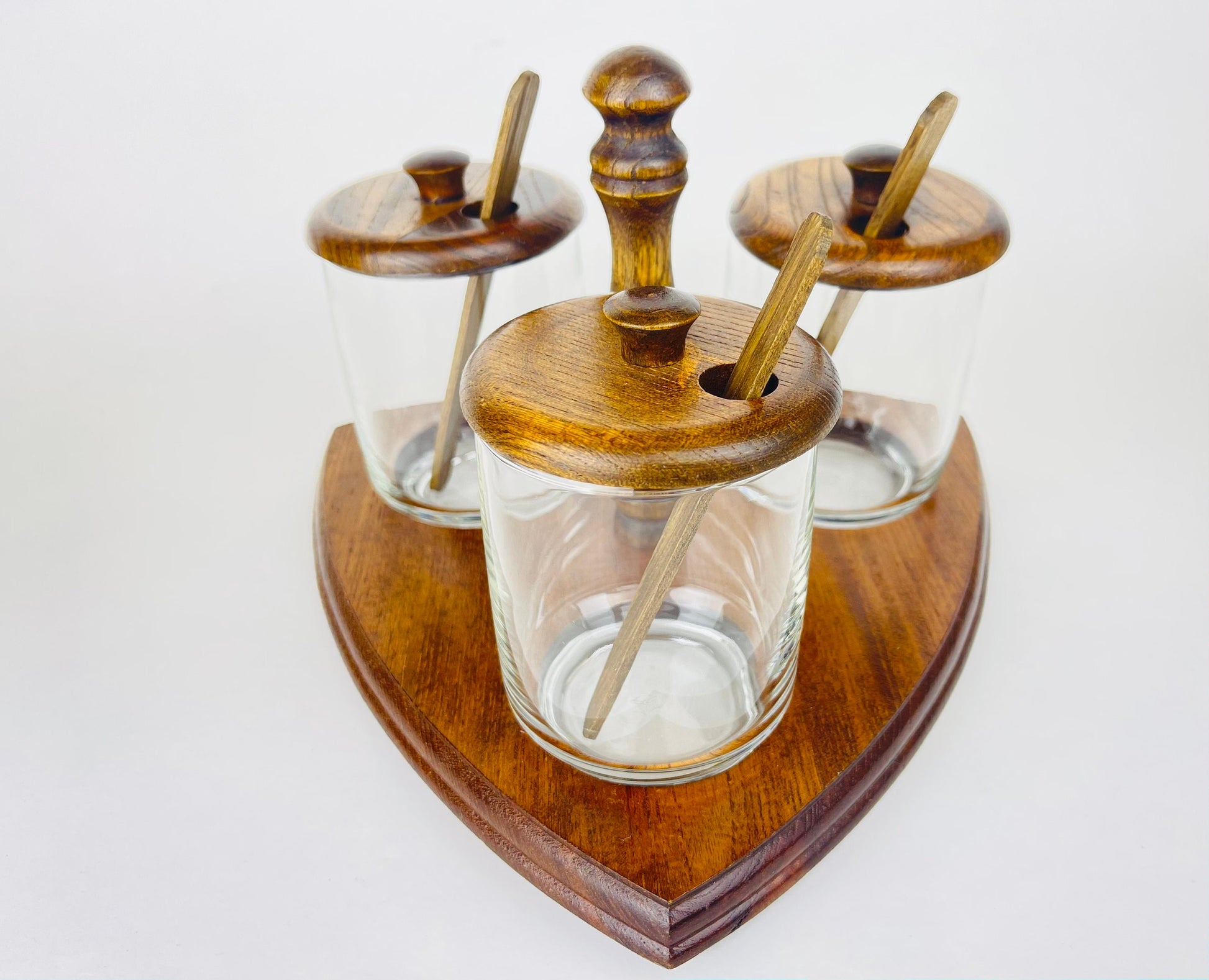 Product image for 'vintage mid century glass condiment caddy set trio of jars with wooden lids spoons' (view b44cc6)