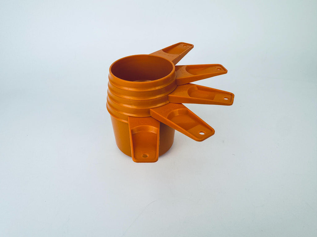Product image for 'vintage stacking plastic tupperware measuring cups set of five 5 made in canada sets sold separately' (view c7d6cc)