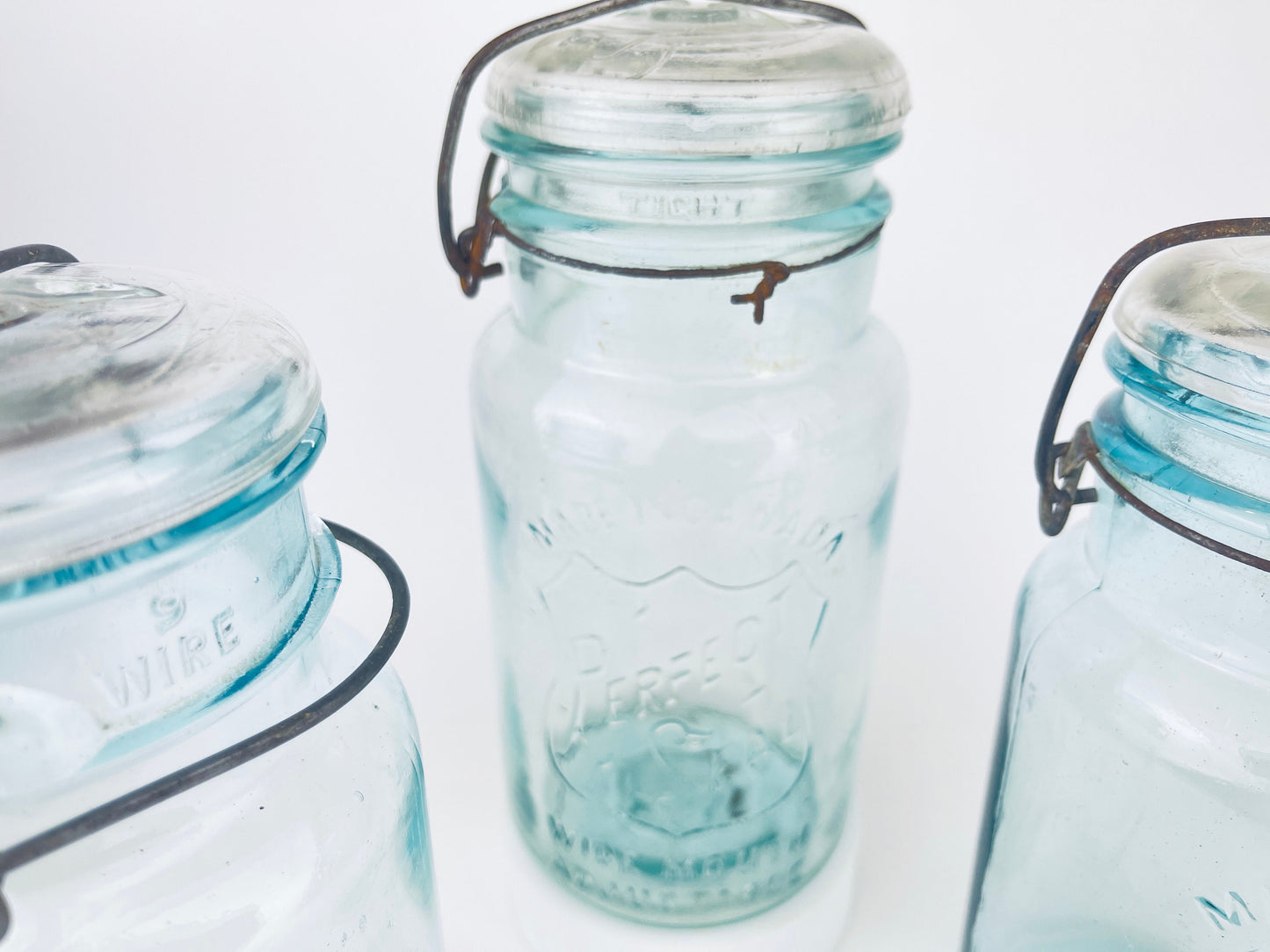 Product image for 'antique safety seal wide mouth aqua blue glass jar 2 pint capacity lightning metal hinge clasp made in canada sold separately 1' (view 0e0f65)