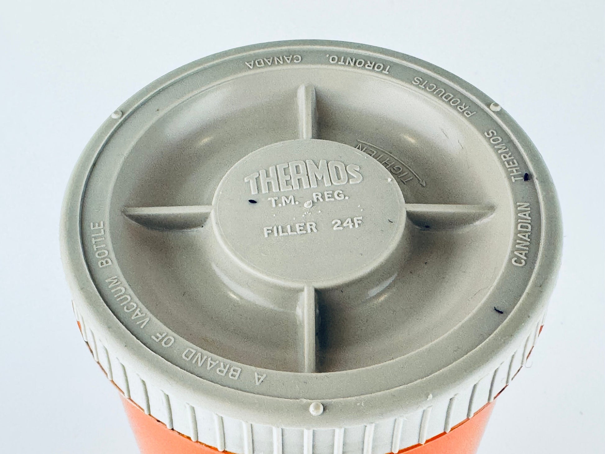 Product image for 'vintage bright orange plastic thermos insulated vacuum sealed jar model 24f made in canada' (view d7d31f)
