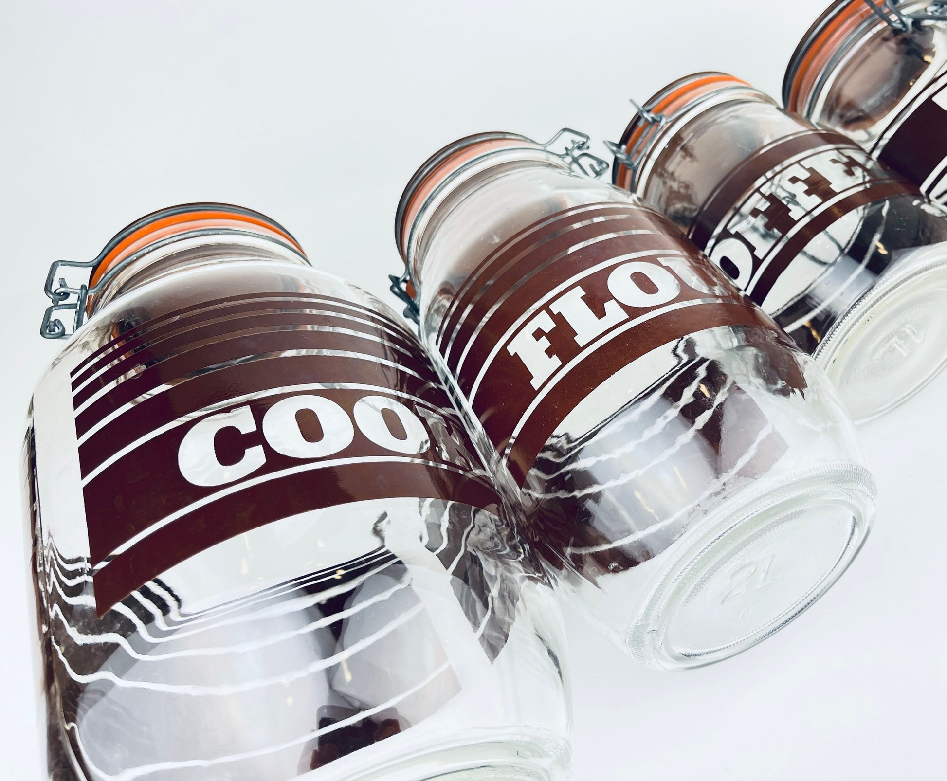 Product image for 'vintage brown striped glass canister set 1980s kitchen storage with orange seals' (view 2f4268)