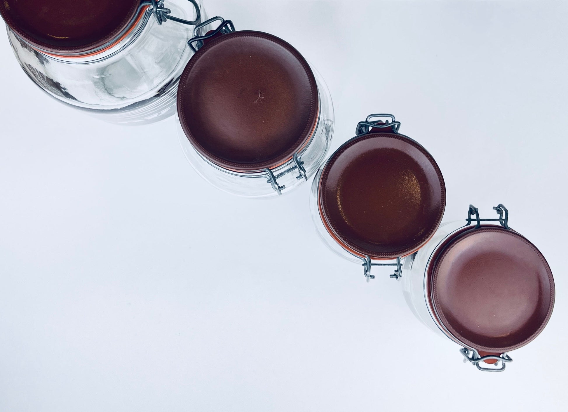 Product image for 'vintage brown striped glass canister set 1980s kitchen storage with orange seals' (view 18d414)