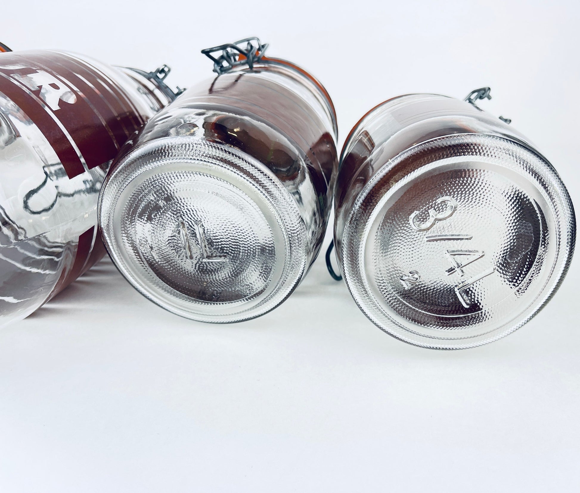 Product image for 'vintage brown striped glass canister set 1980s kitchen storage with orange seals' (view a24728)
