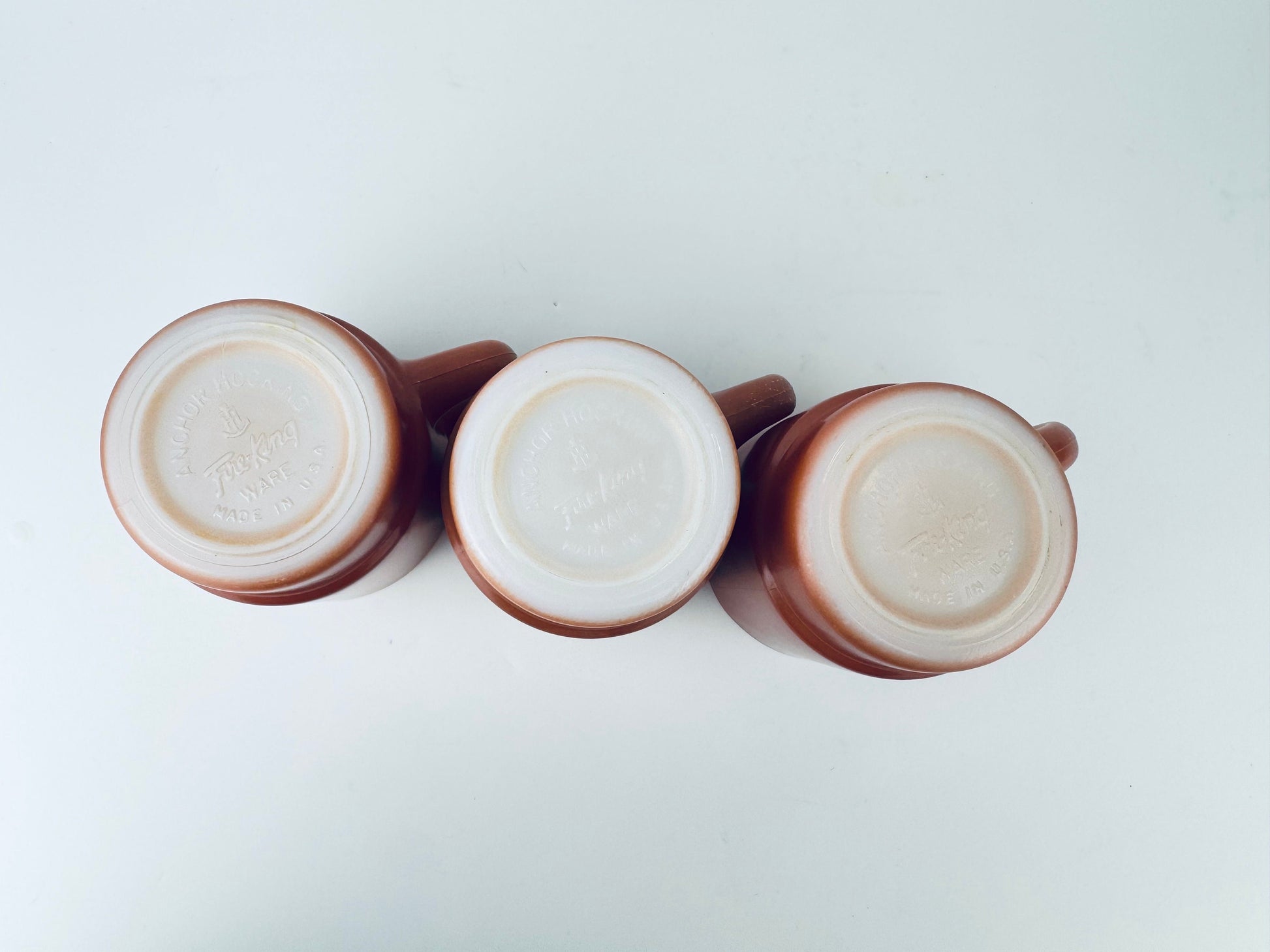 Product image for 'vintage anchor hocking fire king reddish brown stackable glass mug made in usa set of three 3' (view e21721)