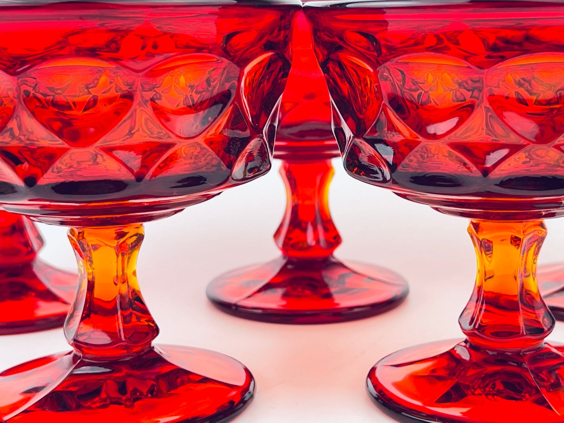 Product image for 'vintage ruby red heavy pressed glass dessert champagne glassware set of five 5 perspective by noritake made in japan' (view d1e807)
