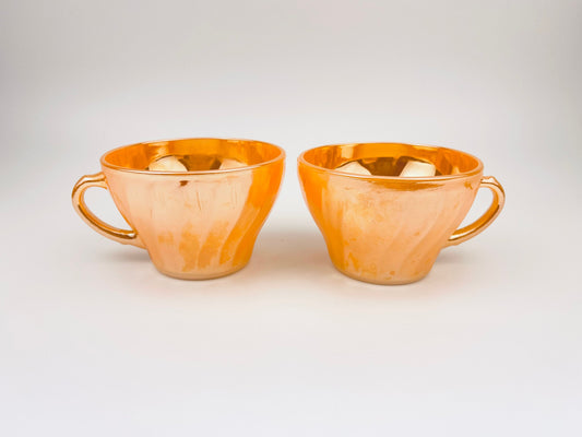 Product image for 'vintage peach lustreware swirl tea cups set of two 2 anchor hocking fire king made in usa' (view b3e4ac)
