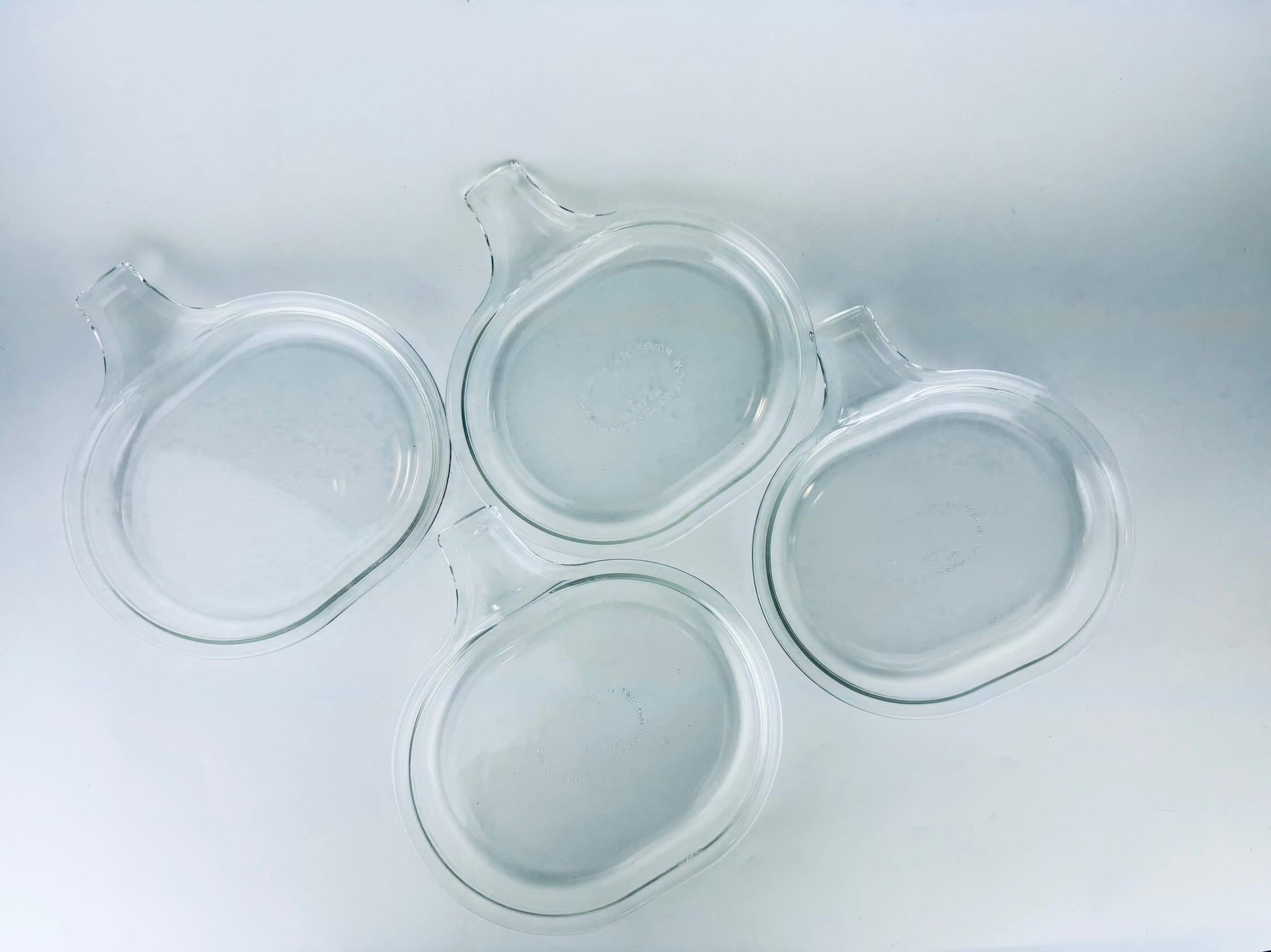 Product image for 'vintage pyrex clear glass grab it microwave oven plates set of two 2 600 b 15 cm x 20 cm made in usa sets sold separately' (view 39dee0)