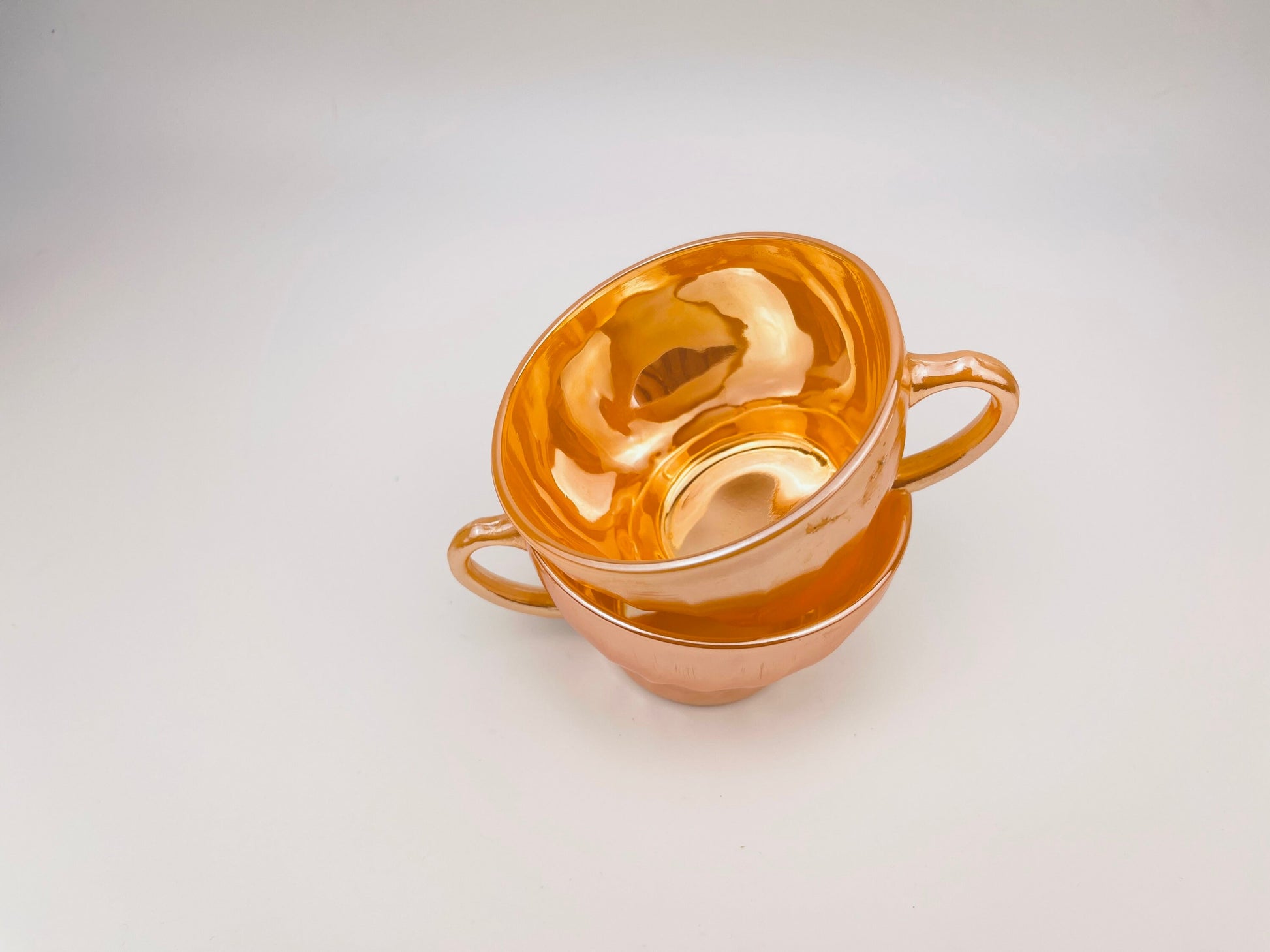 Product image for 'vintage peach lustreware swirl tea cups set of two 2 anchor hocking fire king made in usa' (view c1136b)