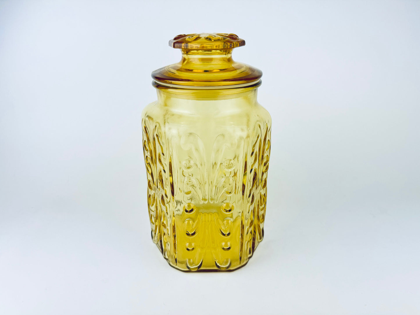 Product image for 'vintage federal glass amber scroll pattern lidded apothecary jar made in usa' (view 77ad81)