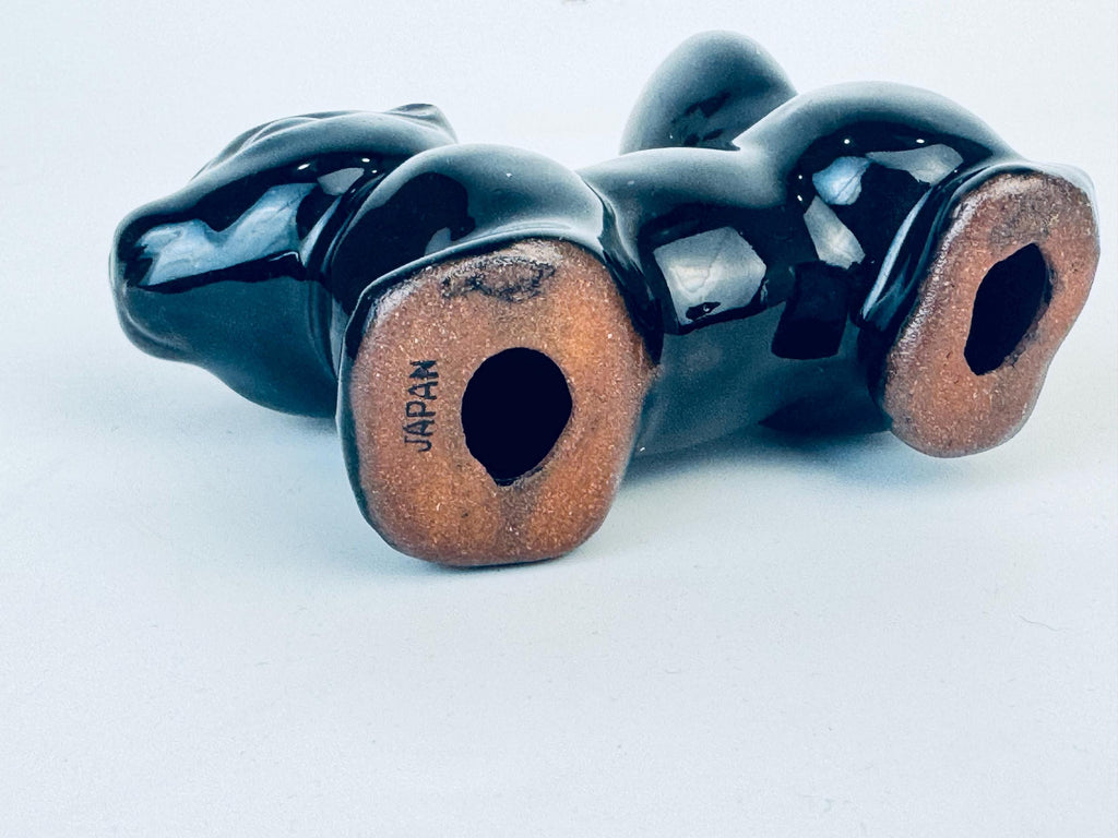 Product image for 'vintage kitsch black skunk red clay figurine made in japan' (view c1aa8f)