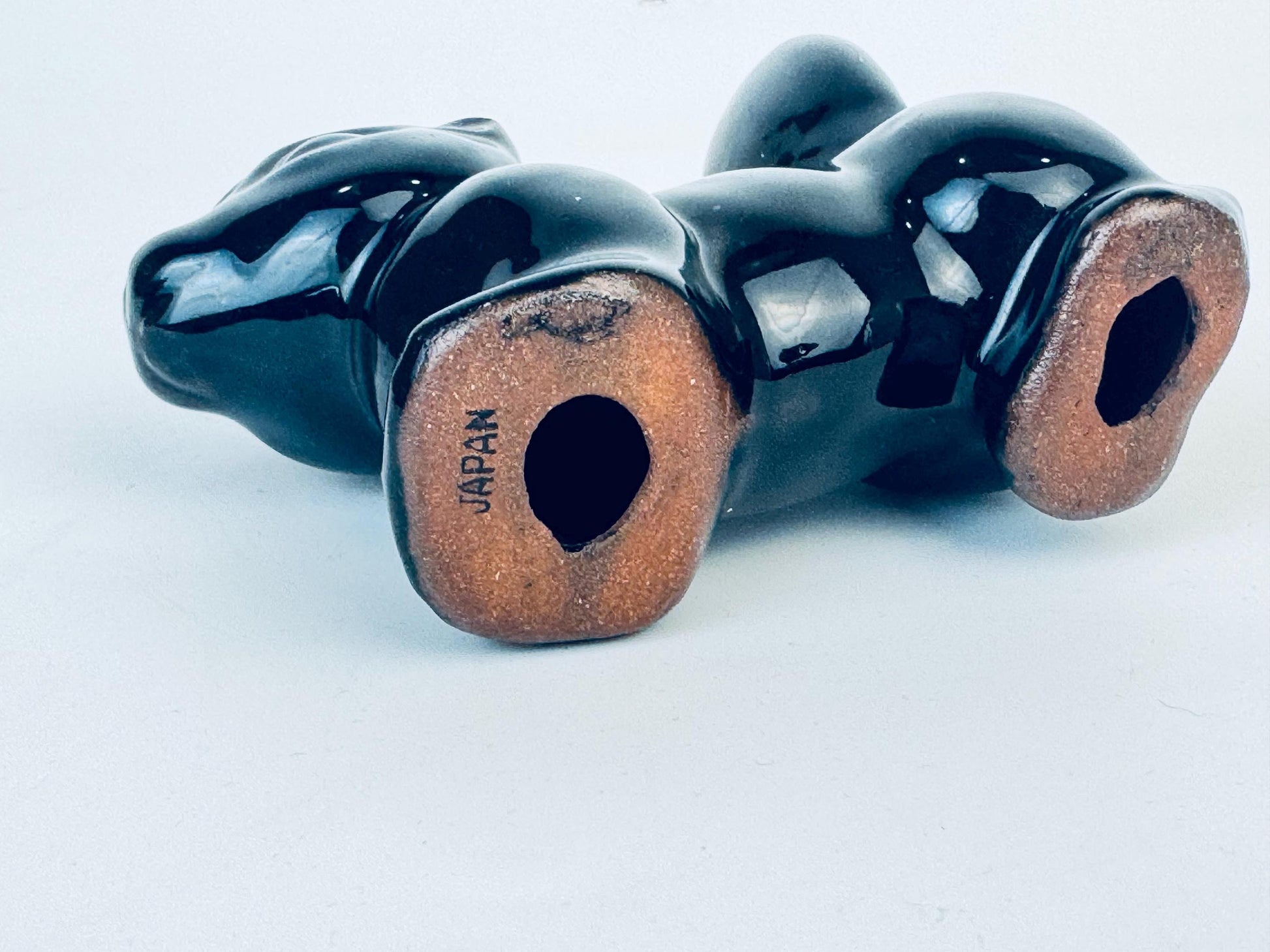 Product image for 'vintage kitsch black skunk red clay figurine made in japan' (view c1aa8f)