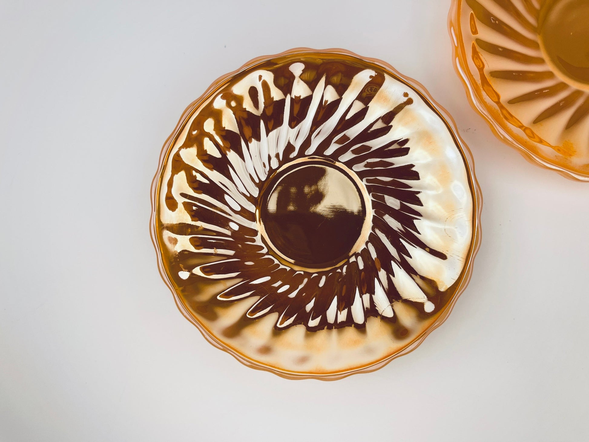 Product image for 'vintage peach lustreware swirl demitasse espresso saucer plate replacement anchor hocking fire king made in usa set of two 2' (view ac406d)