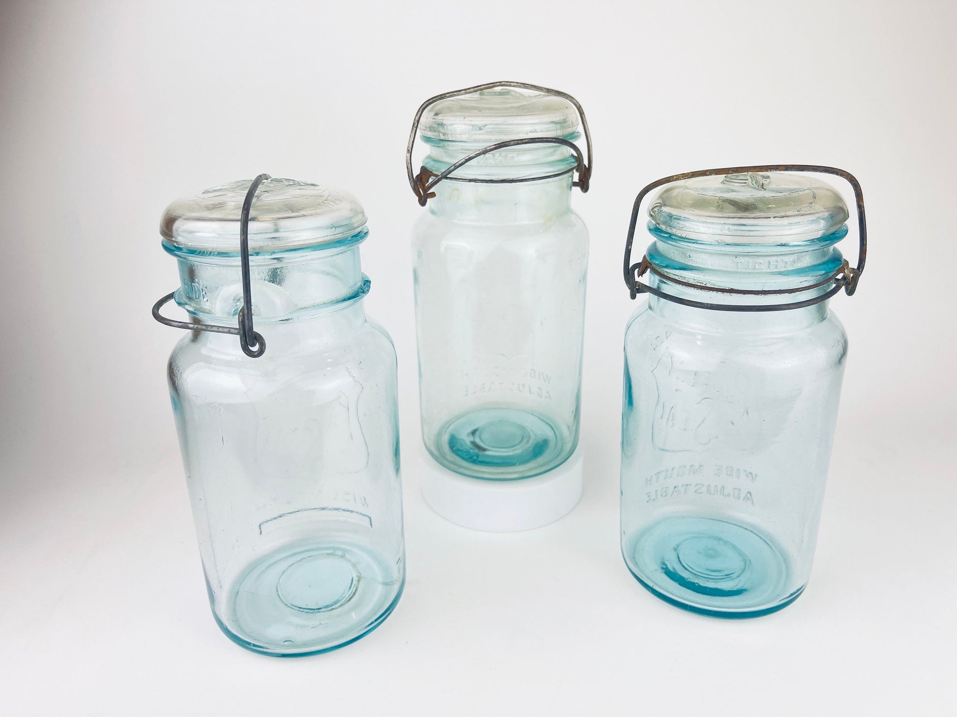 Product image for 'antique safety seal wide mouth aqua blue glass jar 2 pint capacity lightning metal hinge clasp made in canada sold separately 1' (view 4c6dc4)
