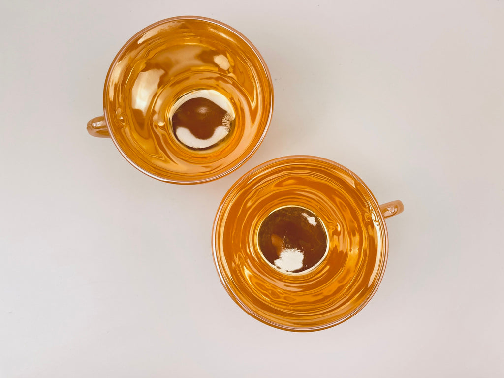 Product image for 'vintage peach lustreware swirl tea cups set of two 2 anchor hocking fire king made in usa' (view a62f08)