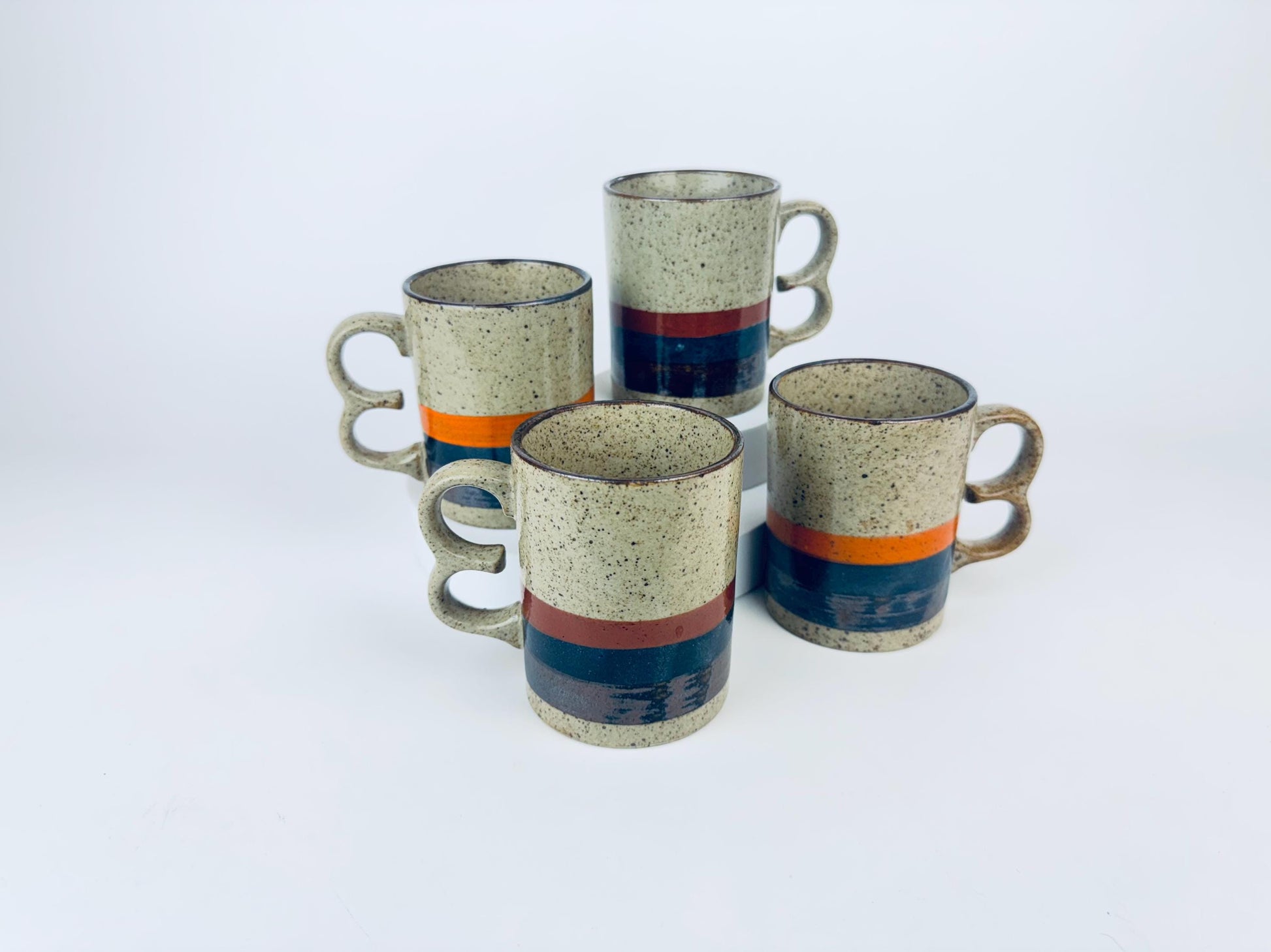 Product image for 'vintage 1970s stoneware mugs speckled glaze with bold stripes double loop handles set of 4 retro coffee cups' (view bb88ec)