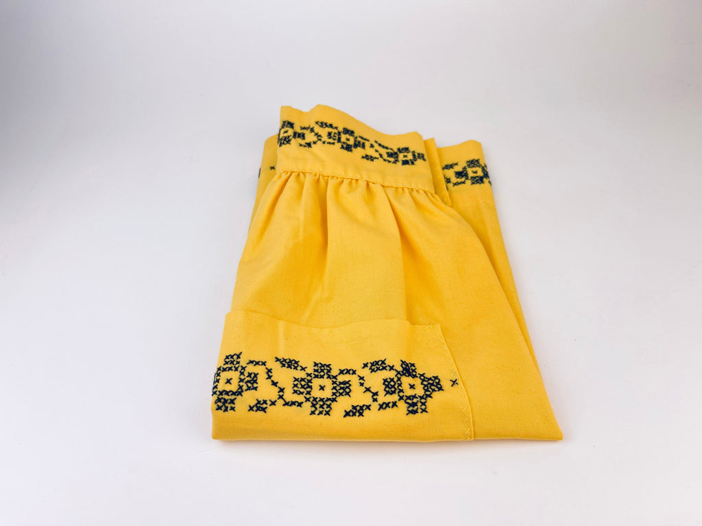 Product image for 'vintage yellow black embroidered waist apron right pocket detail' (view b363bf)
