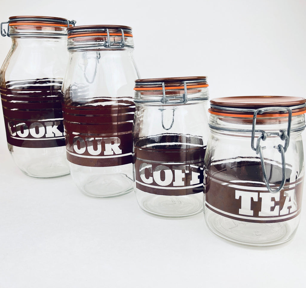 Product image for 'vintage brown striped glass canister set 1980s kitchen storage with orange seals' (view 8e8044)