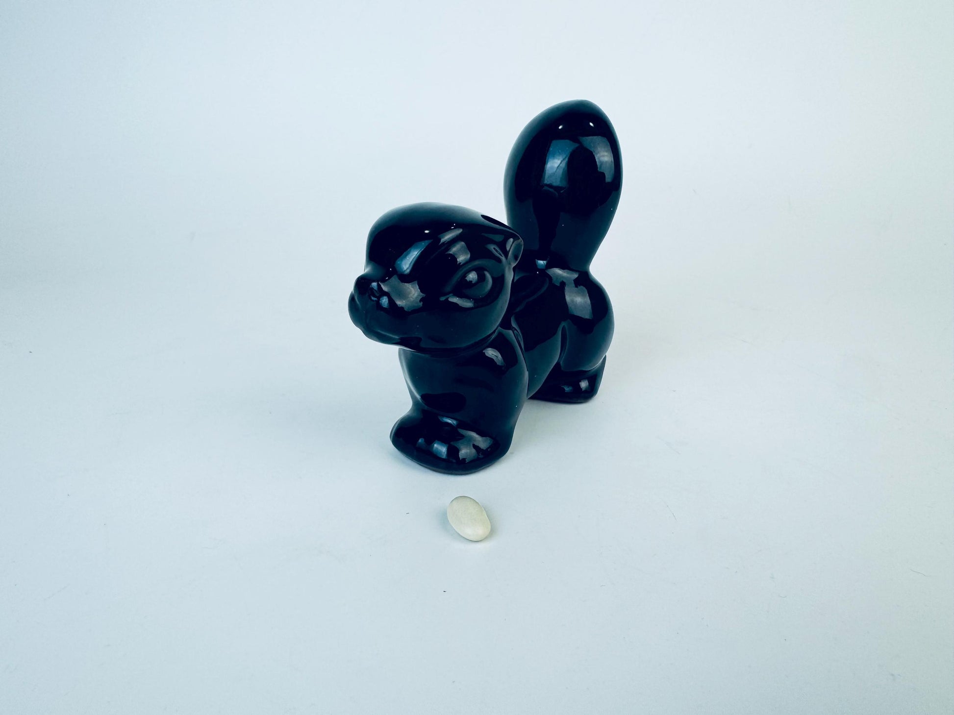 Product image for 'vintage kitsch black skunk red clay figurine made in japan' (view 232f01)