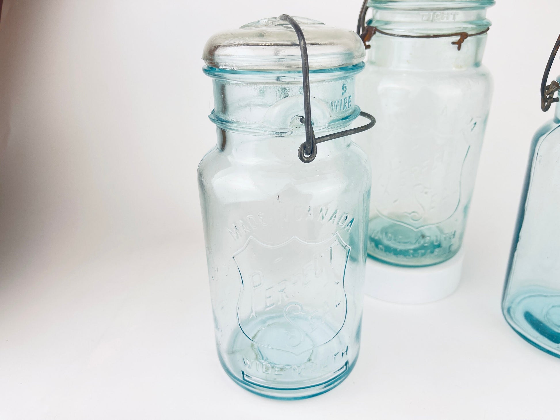 Product image for 'antique safety seal wide mouth aqua blue glass jar 2 pint capacity lightning metal hinge clasp made in canada sold separately 1' (view c7c82b)