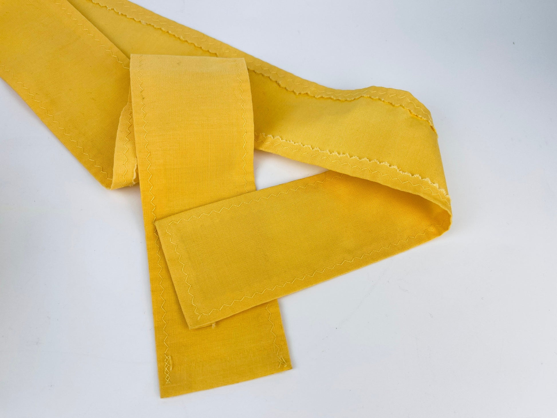 Product image for 'vintage yellow black embroidered waist apron right pocket detail' (view 99ab67)
